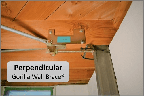 Image of a Perpendicular Gorilla Wall Brace system assembled on the basement floor joist straightening a bowing basement wall.