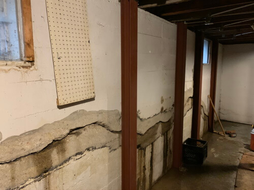 photo of a severely bowed basement wall fixed with Gorilla Wall Braces